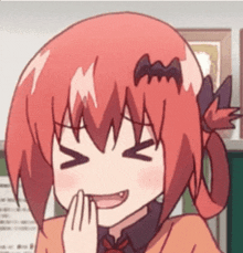 a close up of a cartoon girl with red hair and a bat on her head .