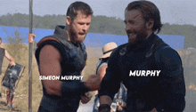 two men named simeon murphy and chris evans are shaking hands