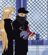 a man and a woman standing next to each other
