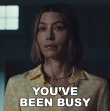 a woman in a yellow shirt has the words you 've been busy above her