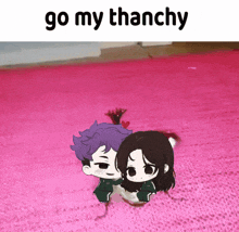 a picture of a boy and a girl on a pink rug with the words go my thanchy above them