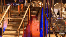 a staircase with a sign that says titanes 6 5 heroes on it