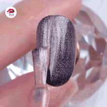 a close up of a nail with nails written on the corner