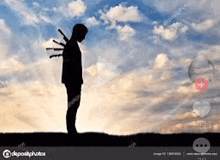 a silhouette of a man with knives stuck to his back