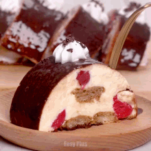 a piece of cake on a wooden plate that says easy plus on it