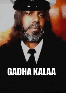 a man with long hair and a beard is wearing a hat and tie with the words gadha kalaa below him
