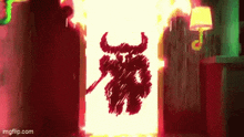 a drawing of a devil with horns is coming out of a wall .
