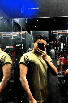 a man taking a picture of himself in front of a mirror with a blue screen that says nisban111222
