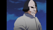 a man wearing a white mask with a skull on it