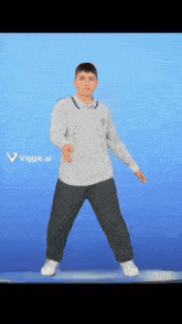 a man in a grey shirt and black pants is dancing in front of a blue background that says viggle.ai on it