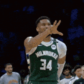 a basketball player wearing a milwaukee jersey number 34