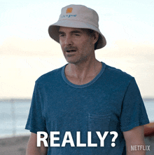 a man wearing a bucket hat and a blue shirt says " really "