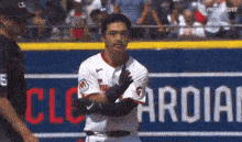 a baseball player with the number 5 on his shirt