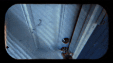a person 's hand is reaching out to open a door