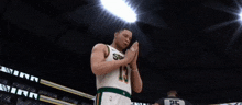 a man in a sonics jersey stands in front of a crowd