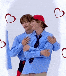 a couple of men hugging each other with hearts around them .