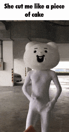 a white bear mascot is standing in a parking garage with the caption she cut me like a piece of cake
