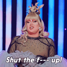 a drag queen is saying shut the f- up