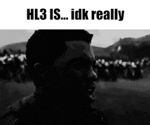 a black and white photo of a man with the words hl3 is ... idk really written above him .
