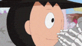 a close up of a cartoon character with a skeleton hand on his face .