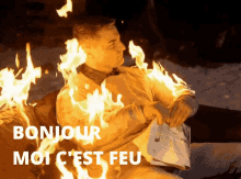 a man is on fire with the words bonjour moi c est feu written below him