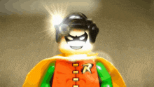a close up of a lego robin figure with a light shining on his face