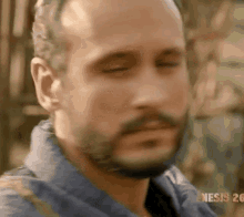 a close up of a man 's face with the words genesis 26 in the background