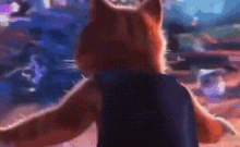 a squirrel is standing in front of a crowd with its arms outstretched .