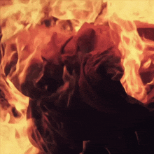 a painting of a person surrounded by flames and smoke