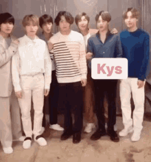 a group of young men are posing for a picture together .