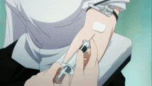 a person is getting a needle in their arm