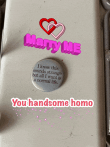 a button that says marry me on top of it