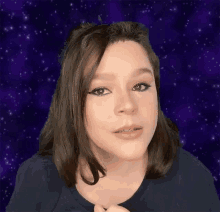 a woman with braces on her teeth is standing in front of a purple background