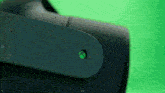 a close up of a green xbox logo on a green background
