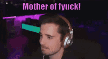 a man wearing headphones with the words mother of fyuck written above him