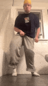 a man wearing a blue shirt that says ' swag ' on it