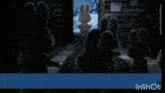 a group of stuffed bunny rabbits are standing in a room in front of a door