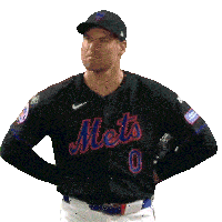 a man wearing a mets jersey with the number 0 on it