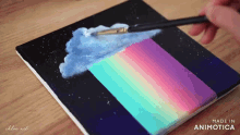 a painting of a cloud with a rainbow coming out of it is made by chloe art