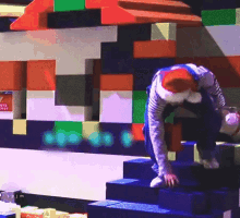 a person is crawling up a set of stairs in front of a wall with chinese writing