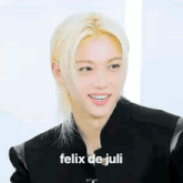 a close up of a person 's face with the word felix de juli written on it .