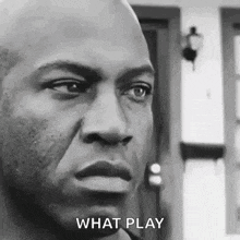 a black and white photo of a man 's face with the words `` what play '' written below it .