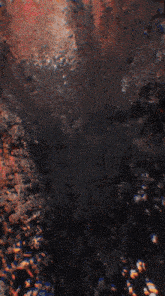 a painting of a cave with a red light coming out of the bottom