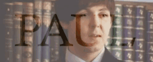 a close up of a man 's face with the word paul written above him