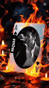 a man is smoking a cigarette in front of an ace of spades card