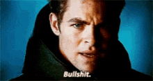 a close up of a man 's face with the words bullshit written below him