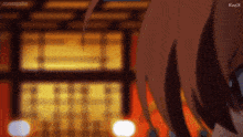 a close up of a person 's face with a blurry background and the letters kwix on the bottom right