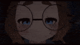 a close up of a person wearing glasses and a tie
