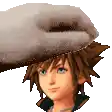 a hand is putting a towel on the head of a boy .