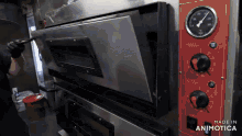 a stainless steel oven with the words made in animotica on the bottom
